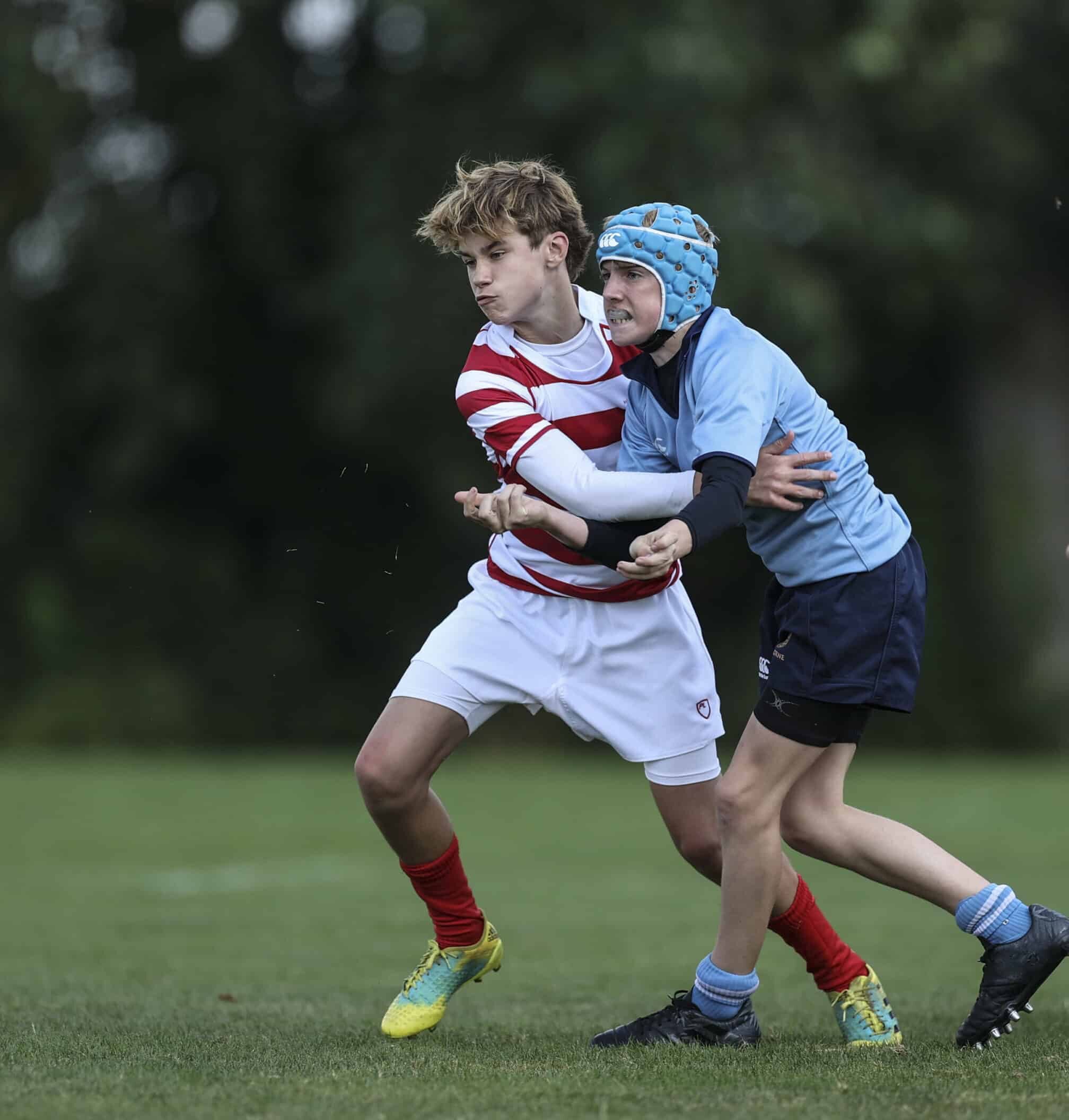 Boy playing Rugby in a fixture for Radley College