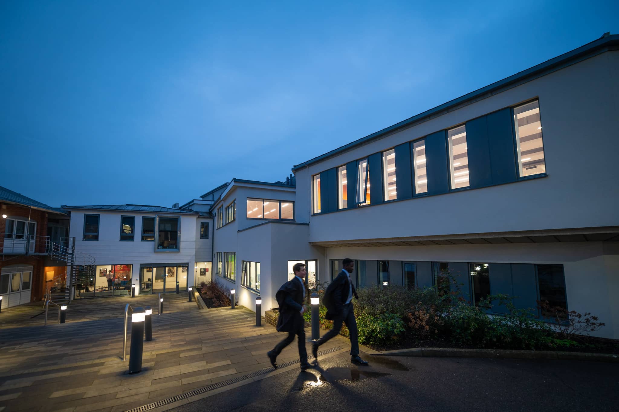 Boys walking through Radley College at night