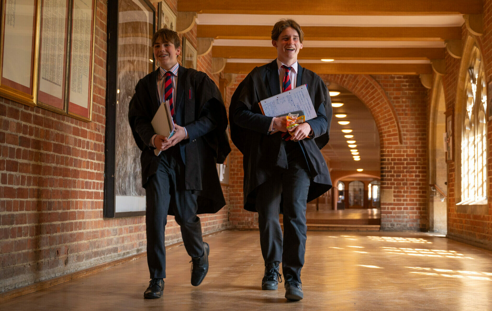 Boys walking down covered passage at Radley College
