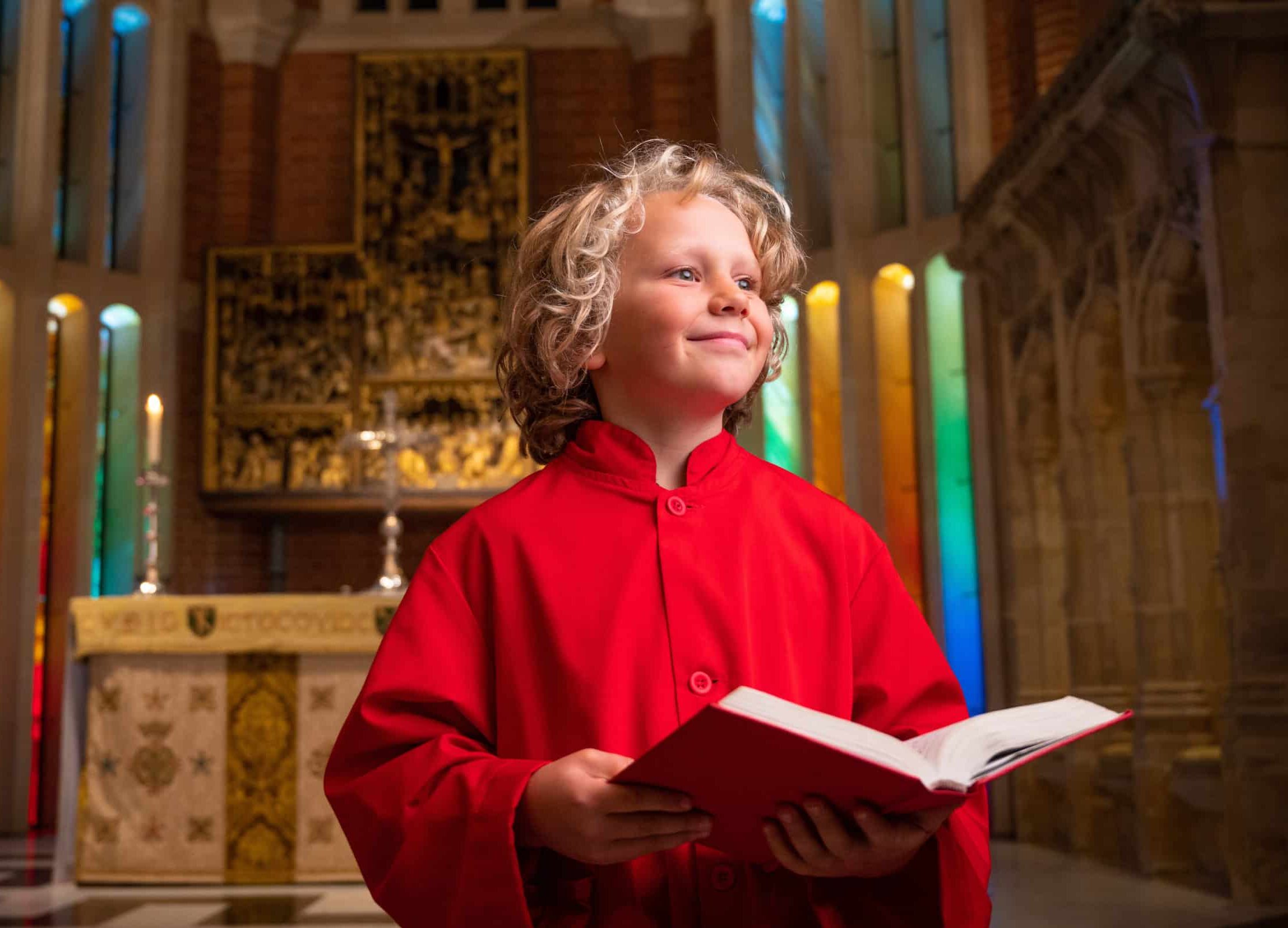 Boy chorister smiling in the Chapel of Radley College