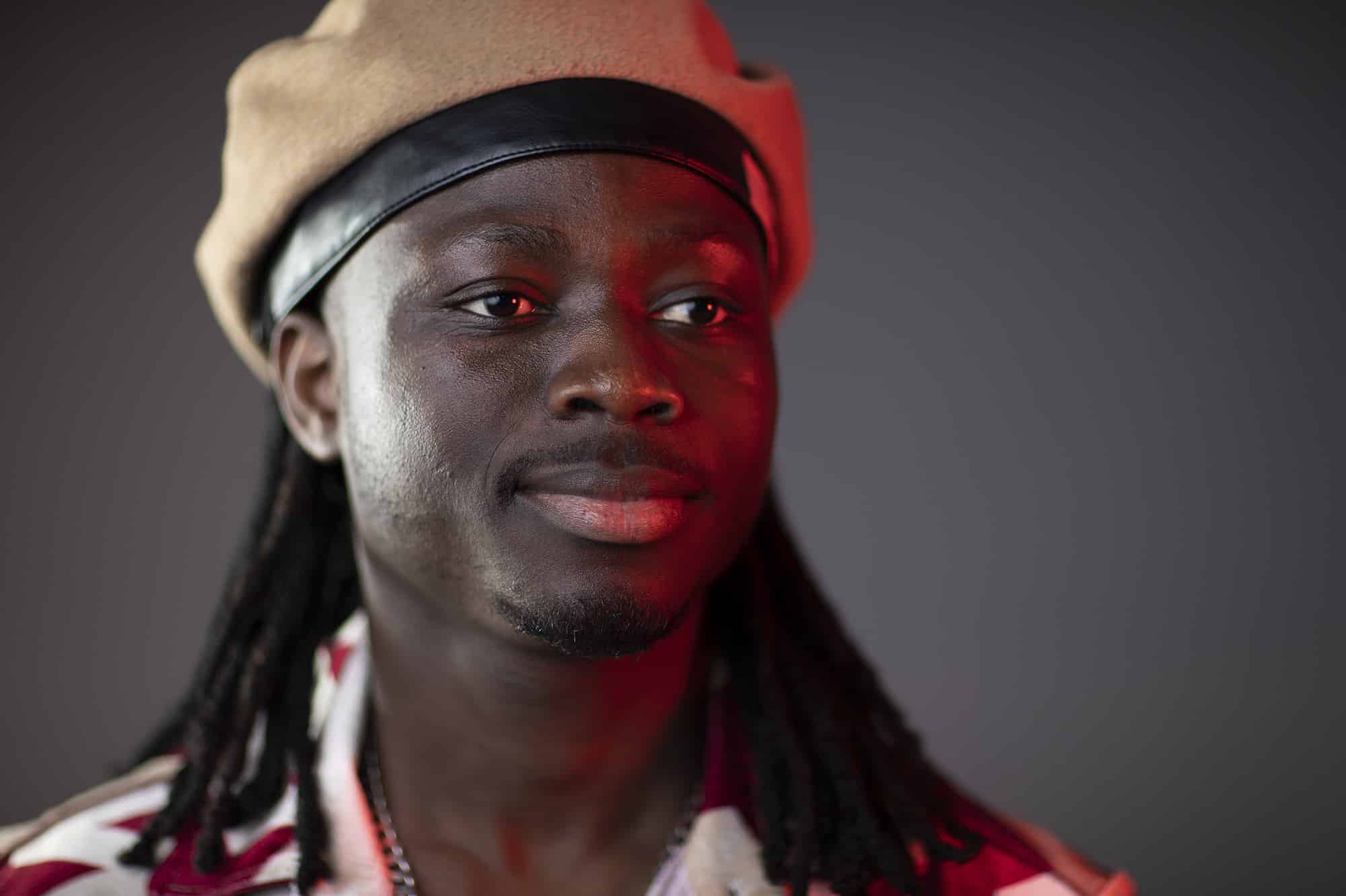 Close up of Nfamady-Kouyate wearing a hat